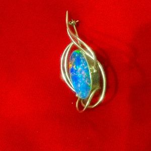 A fire opal pin